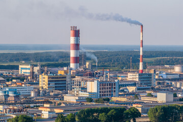 aerial view on pipes of chemical enterprise plant. Air pollution concept. Industrial landscape environmental pollution waste of thermal power plant