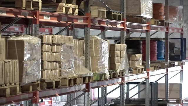 large factory warehouse. Shop aisles. The camera pans inside a large store. Delivery to the warehouse. Logistic business and vehicle with forklift to move boxes and goods. freight mail industry