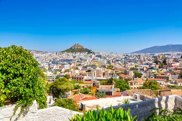Fotobehang Old city Plaka Athens view with mount Lycabettus during summer sunny day © Nikolay N. Antonov
