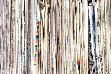 Close up image of a bunch or pack of old newspapers