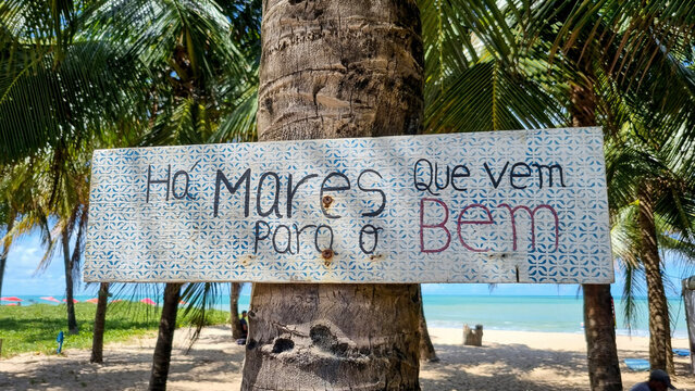Motivational sign on the beach