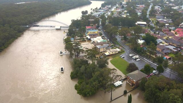 Aerial drone view of major flooding along Georges River at East Hills in South West Sydney, NSW, Australia during severe rainfall weather in July 2022 