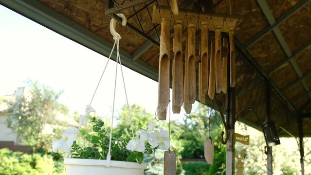 Bamboo wind chimes in the teras of the house in the wind