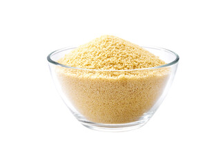 organic couscous in a clear glass bowl isolated on white background.