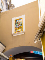 Religious panel in the street on the isle of Capri in the Bay of Naples in Italy