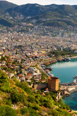 Fototapeta na wymiar Modern landscape of Alanya city with old Kizil Kule tower, view from above