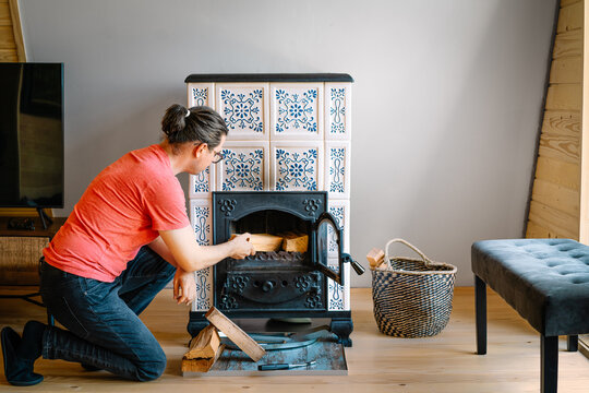 Man by burning terracotta stove