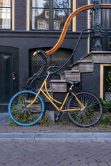 Fototapeta na wymiar Yellow and blue bike in Amsterdam