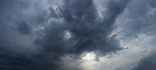 Obraz premium Panorama of dark sky with rainy clouds.