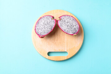 Fresh dragon fruit on wooden board (Funny facial concept), Tropical fruit in summer season