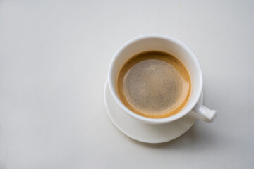 cup of coffee on white table