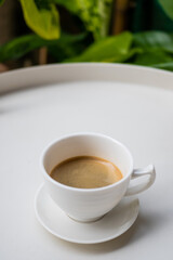 cup of coffee on white table