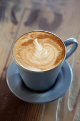 Coffee with milk on the restaurant table.