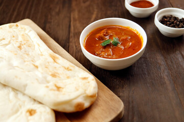 Nan made from wheat to eat with Indian curry on the table