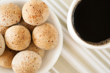 Pao de Queijo Integral com cafe preto - Brazilian Food, cheese bread, black coffee, top view