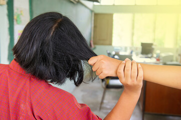 Schoolgirl pulling her friend's hair