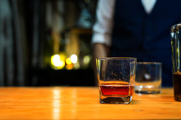 Bartender Serve Whiskey, on wood bar, 