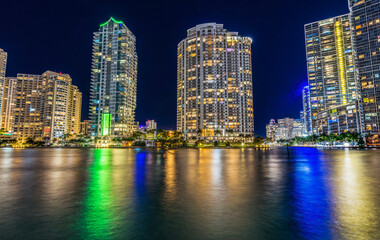 Fototapeta na wymiar Miami River Night Water Reflections Apartment Buildings Downtown Miami Florida