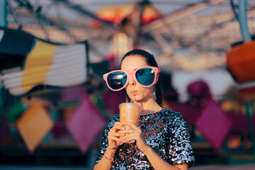 Woman Wearing Oversized Party Glasses Sipping from a Plastic Cup - Funny young person having a...