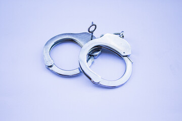 Image of a pair of handcuffs with white background