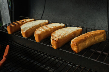 Hot dog buns on a barbecue grill