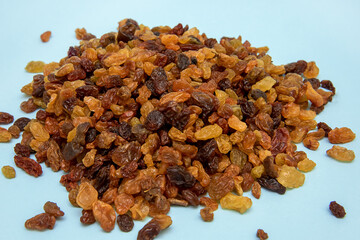 raisins close-up on a light blue background