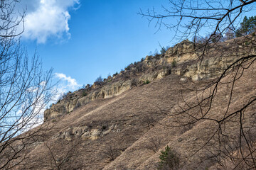 Rocky slope of a mountain range in a clear sunny day