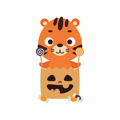 Cute Halloween tiger sitting in a trick or treat bag with candy. Cartoon animal character for kids t-shirts, nursery decoration, baby shower, greeting card, invitation. Vector stock illustration