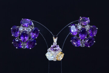 Women's earrings and accessories that has been decorated on a black screen