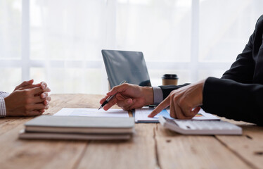 Team of Business brainstorming planning analyzing the financial report, Marketing plan researching. Paperwork on the table, laptop computer.Brainstorming Group of people Working Concept. 