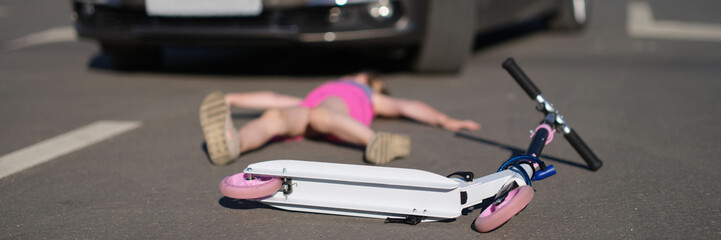A child on a scooter was hit by a car, close-up