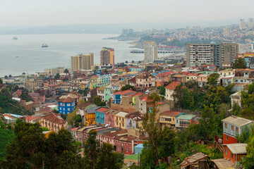 Fototapeta na wymiar Valparaiso aerial cityscape with mist with Pacific Ocean harbour, Chile.