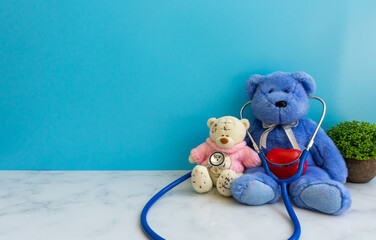 Children doctor concept - Teddy Bear with stethoscope. copy space