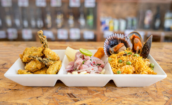 Peruvian food: Fish ceviche, rice with seafood and fish cracklings.