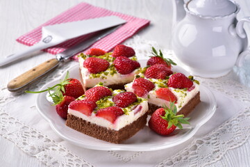 Curd cheese cake slices with strawberries