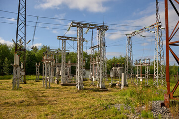 Fototapeta premium high-voltage electrical substation against the blue sky