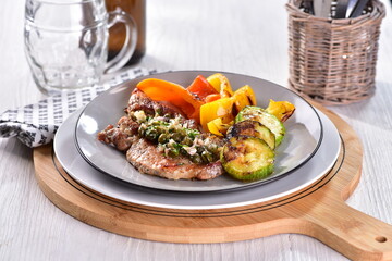 Grilled pork chops with caper butter