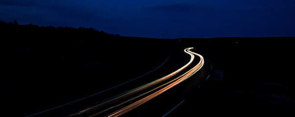 traffic on highway at night, blurry lights