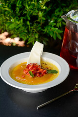 mango panna cotta in a white plate