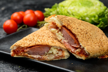 bun sandwich with sesame and sausage