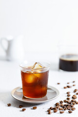 Iced Coffee on white marble table.