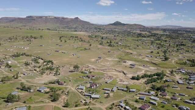 Aerial wide. African Village houses and homesteads near Maseru, in the mountain kingdom of Lesotho in Southern Africa. Daytime.