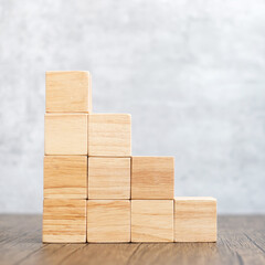 Cube wooden block on the building. Business goal, growth, planning, Risk Management, Solution, strategy Concepts