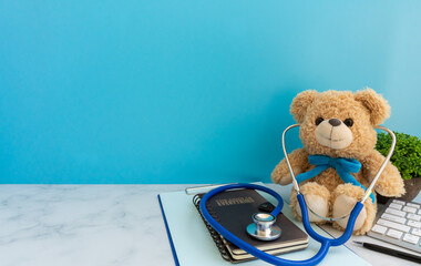 Children doctor concept - Teddy Bear with stethoscope. copy space