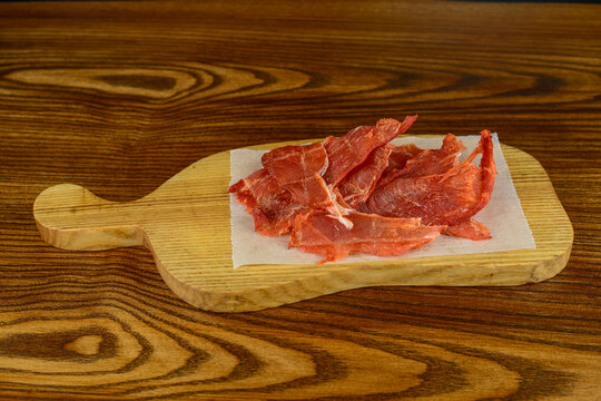 Pork Jerky On A Wooden Board