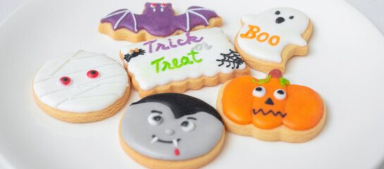 Happy Halloween with funny Cookies; Pumpkin, scary ghost, spooky mummy, bat, frankenstein, dracula and spider. Trick or Threat, Hello October, fall autumn, Traditional, party and holiday concept