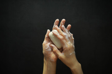 Bare hands in soapy foam. Hand hygiene. Wash your hands. Disinfection with soap protection against viruses.