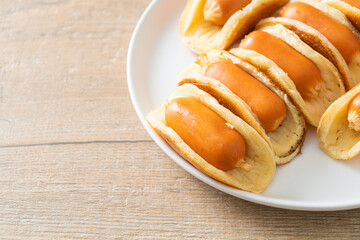 flat pancake roll with sausage