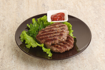 Grilled beef burger cutlet with sauce