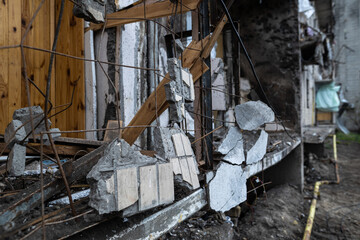 KYIV, UKRAINE - APR 21, 2022: The facade of an apartment building on Koshytsia str. was destroyed by the Kalibr cruise missile on the second day of the full-scale Russian invasion of Ukraine.